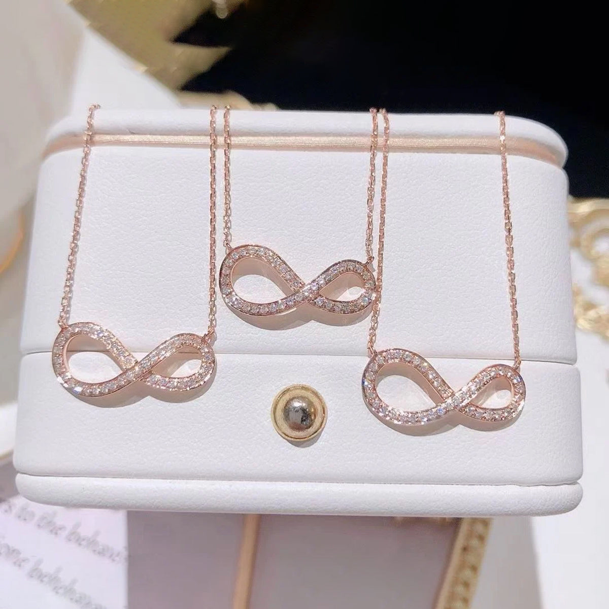 jewelvyn Rose Plated Studded With Cubic Zirconia In Infinity Shape Chain Pendant
